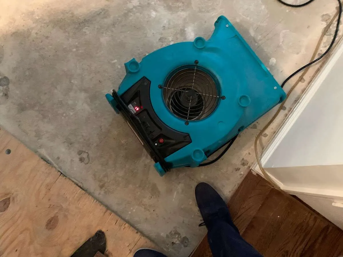 Air mover drying subfloor during Leak Detection & Repair in Bath